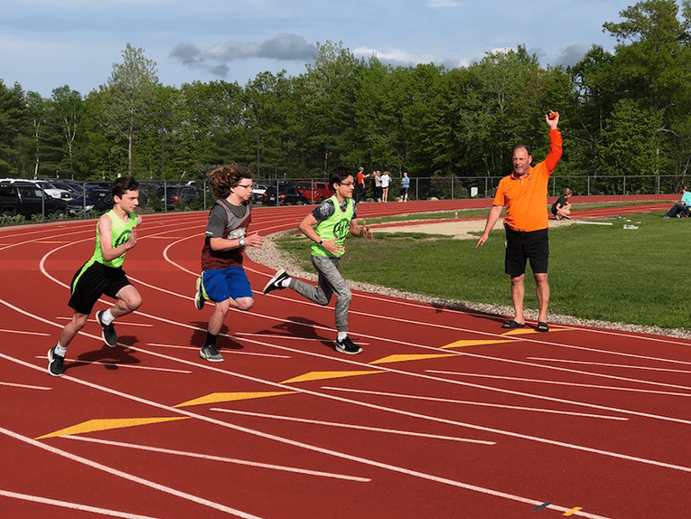 Young people running on outdoor track